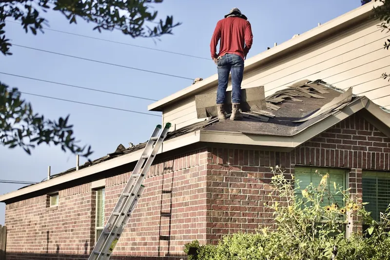 Professional roofer working on a residential roof in The Colony at Valley Forge